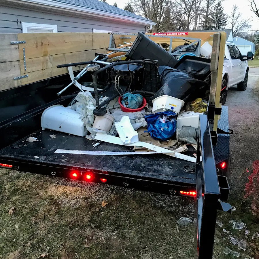 Roll-off dumpster delivered to a residential driveway in Hillside