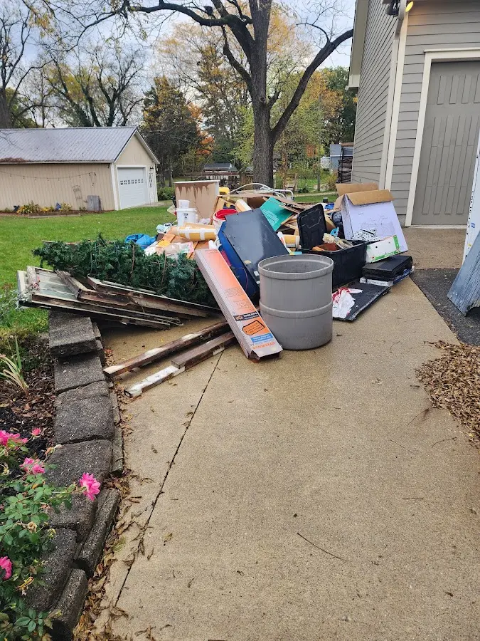 Dumpster being loaded with debris for 3 Yard Dumpster Rental in Hillside
